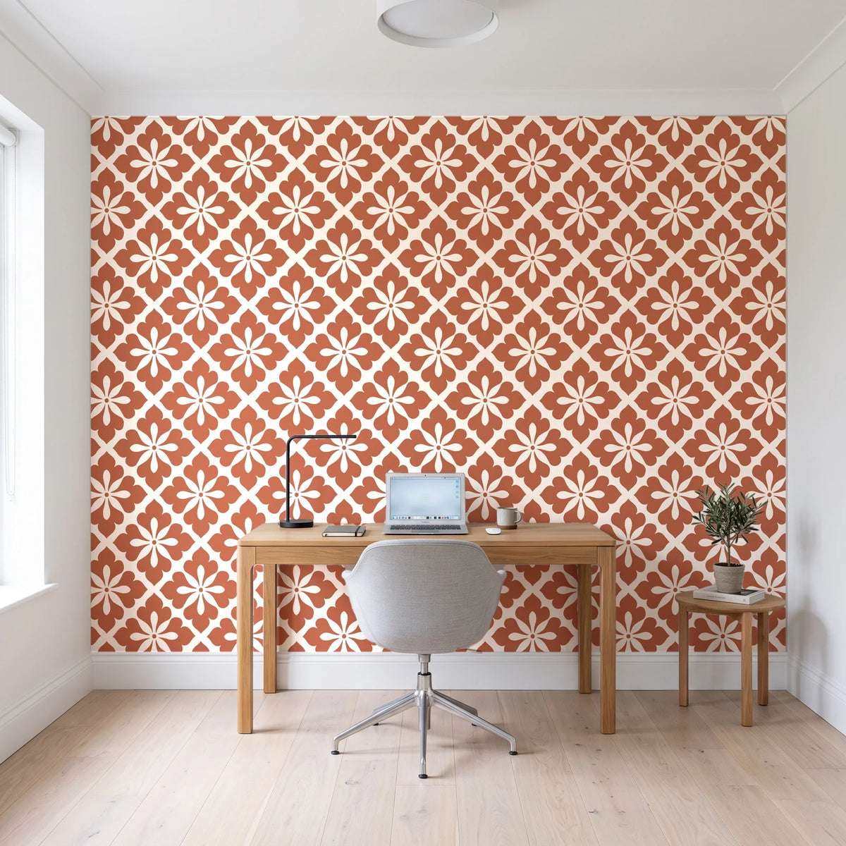 Carbon Bloom Terracotta tile floral wallpaper behind a modern oak desk in a bright home office