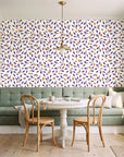 Cerulean Petal Plum ditsy botanical wallpaper as a feature wall in a sunlit breakfast nook