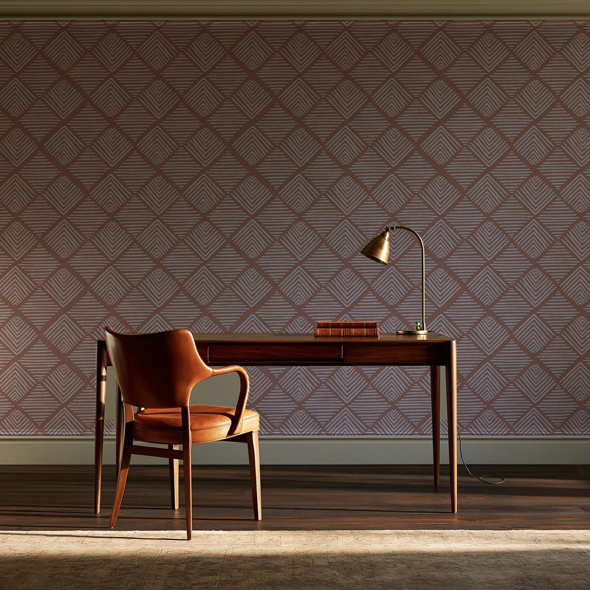 Chevron Etch Clay geometric diamond wallpaper as a feature wall in a home study