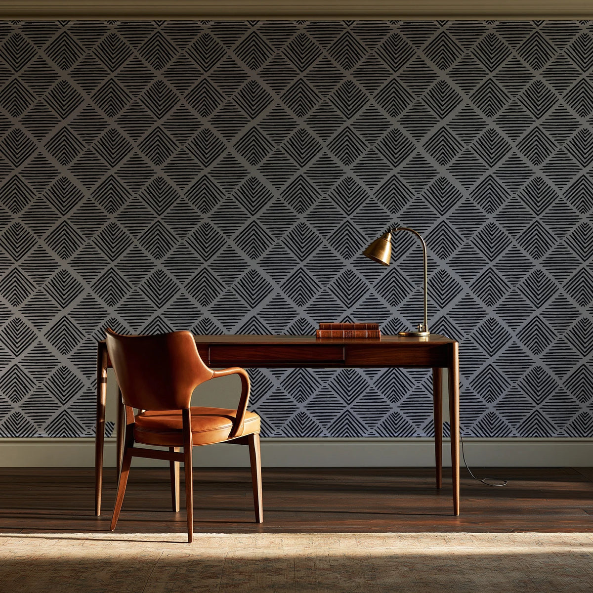 Chevron Etch Ebony geometric diamond wallpaper as a feature wall in a home study