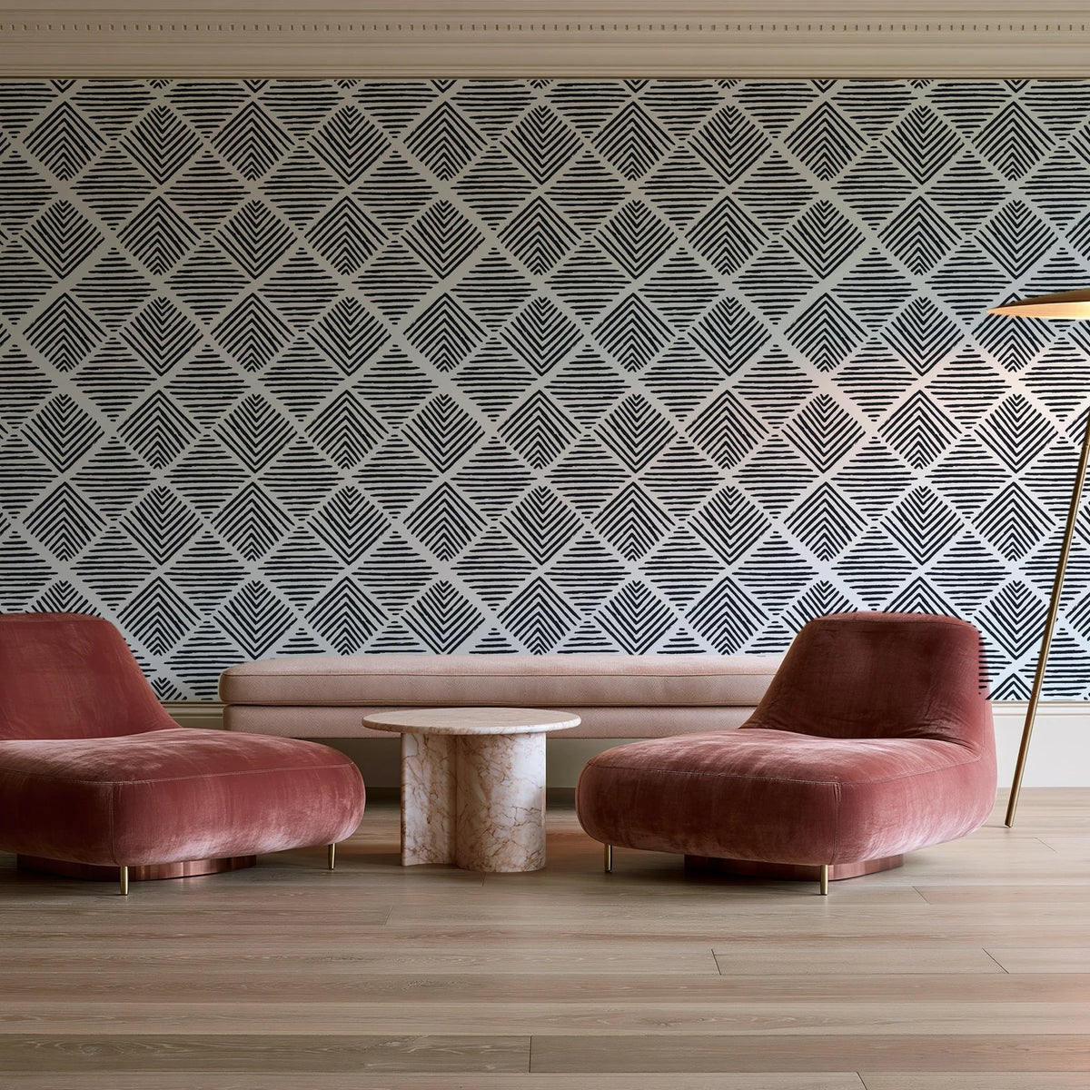 Chevron Etch Ebony geometric diamond wallpaper in a boutique hotel sitting area