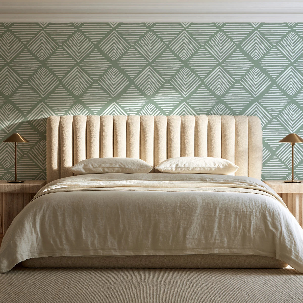 Chevron Etch Sage geometric diamond wallpaper behind a channel-tufted bed in a calm primary bedroom