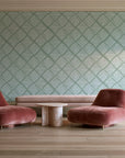 Chevron Etch Sage geometric diamond wallpaper in a boutique hotel sitting area