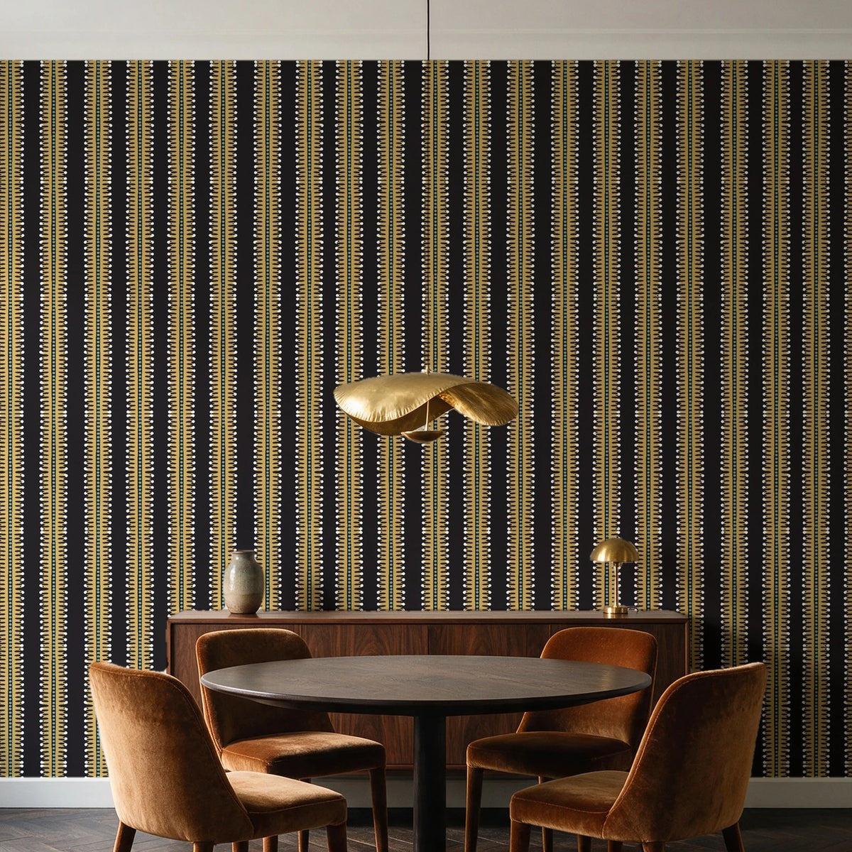 Citrine Column Noir stripe wallpaper behind a walnut credenza and round table in an elegant dining room