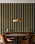 Citrine Column Noir stripe wallpaper behind a walnut credenza and round table in an elegant dining room