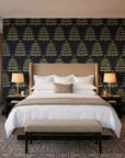 Clipped Dreams Noir tree wallpaper behind the headboard of a king bed in a contemporary hotel guest room