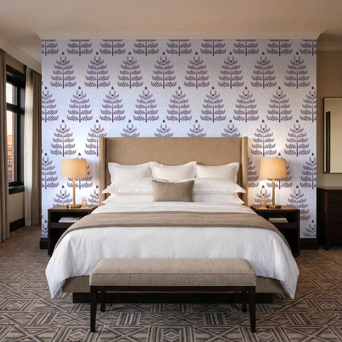 Clipped Dreams Plum tree wallpaper behind the headboard of a king bed in a contemporary hotel guest room