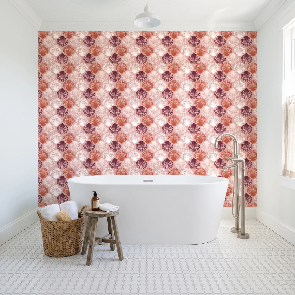 Coastal Scallop Blush scallop shell wallpaper behind a freestanding tub in a bright coastal bathroom