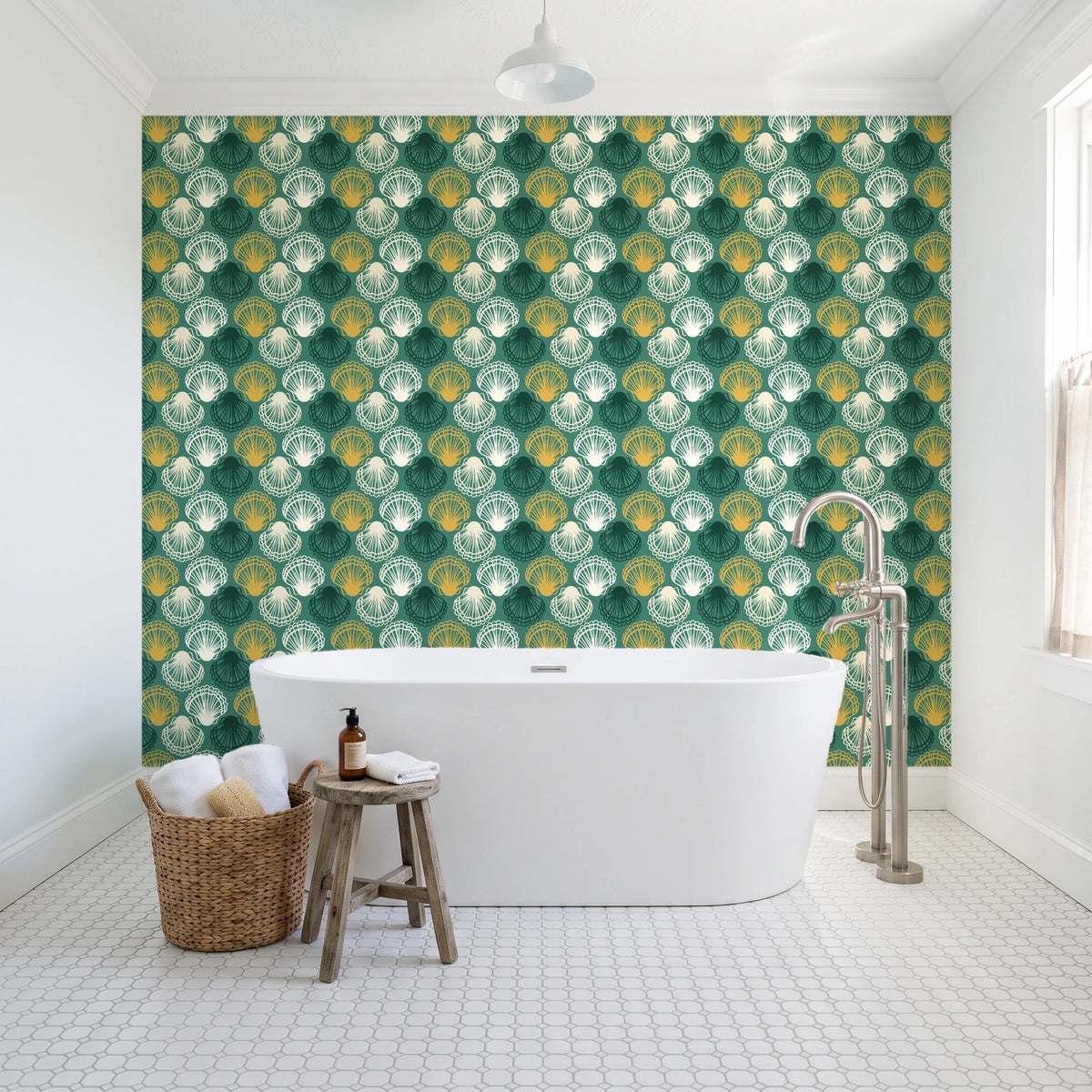 Coastal Scallop Emerald scallop shell wallpaper behind a freestanding tub in a bright coastal bathroom