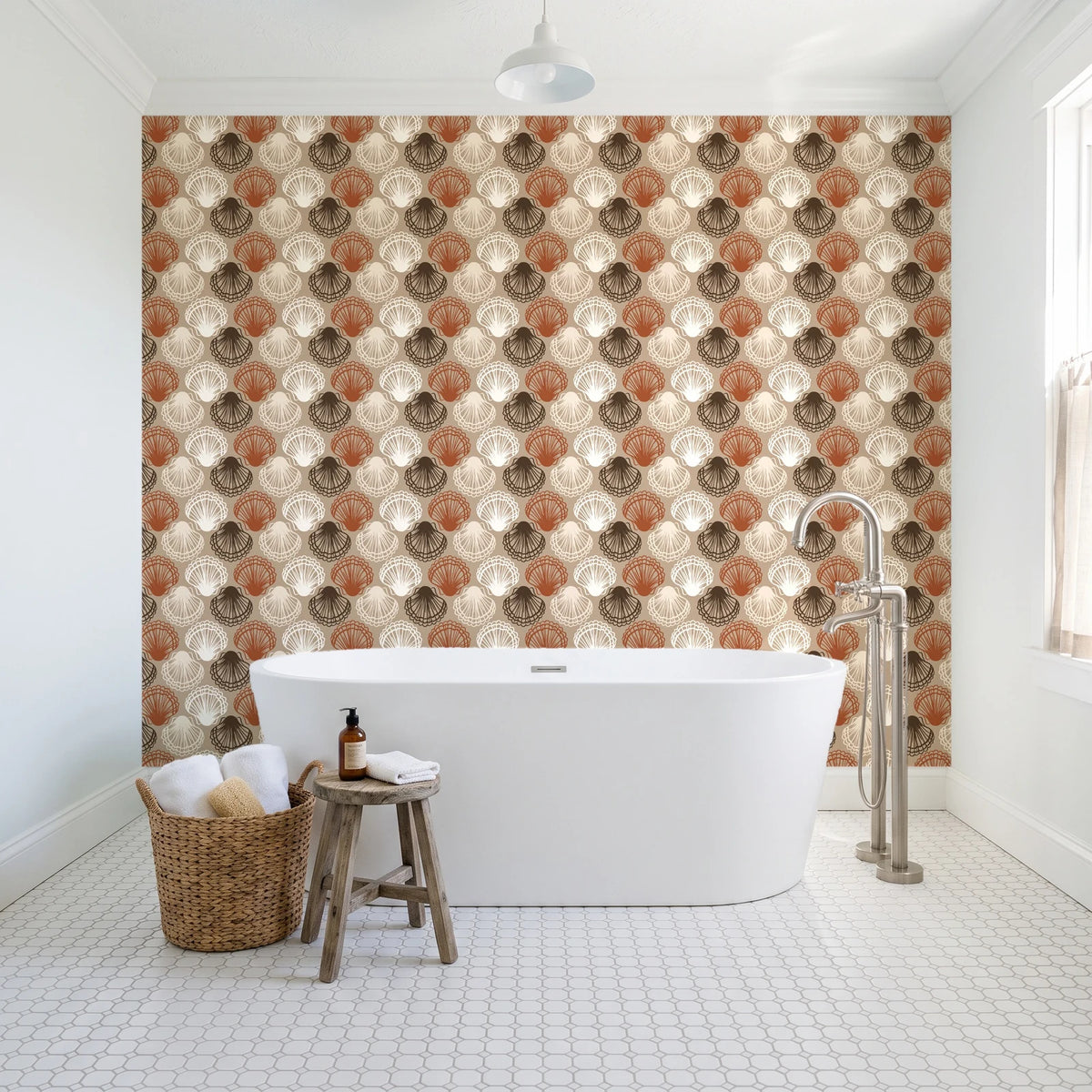 Coastal Scallop Mocha scallop shell wallpaper behind a freestanding tub in a bright coastal bathroom