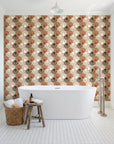 Coastal Scallop Mocha scallop shell wallpaper behind a freestanding tub in a bright coastal bathroom