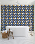 Coastal Scallop Navy scallop shell wallpaper behind a freestanding tub in a bright coastal bathroom