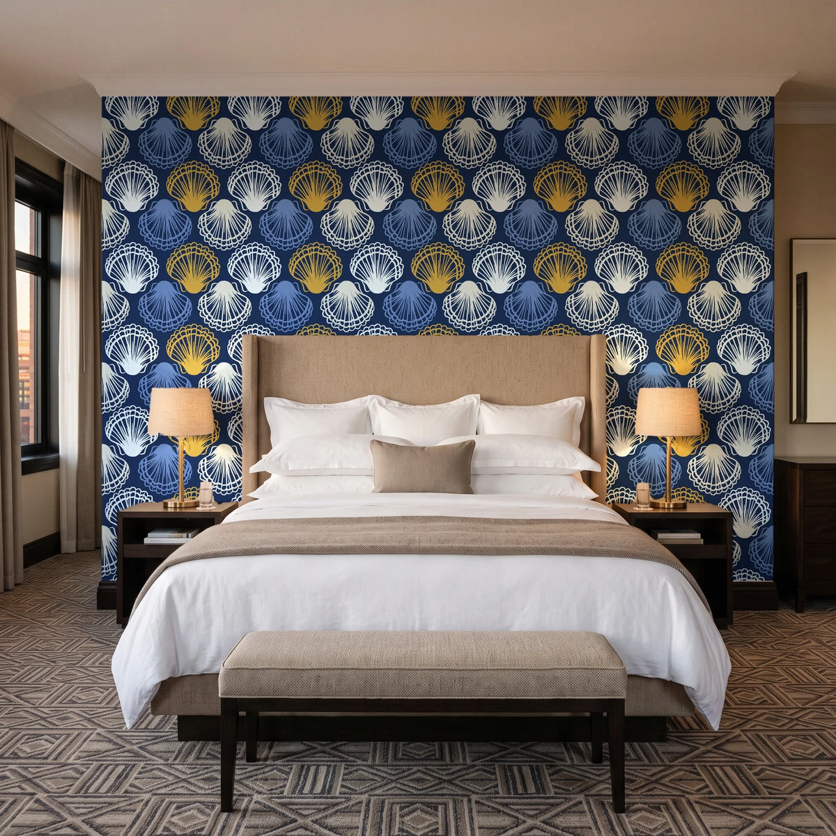 Coastal Scallop Navy scallop shell wallpaper behind the headboard of a king bed in a contemporary hotel guest room