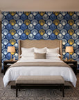 Coastal Scallop Navy scallop shell wallpaper behind the headboard of a king bed in a contemporary hotel guest room
