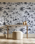 Coastal Village Charcoal palm toile wallpaper on the wall of a grand entry foyer