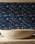 Coastal Village Midnight palm toile wallpaper creating ambiance in a serene spa bathroom