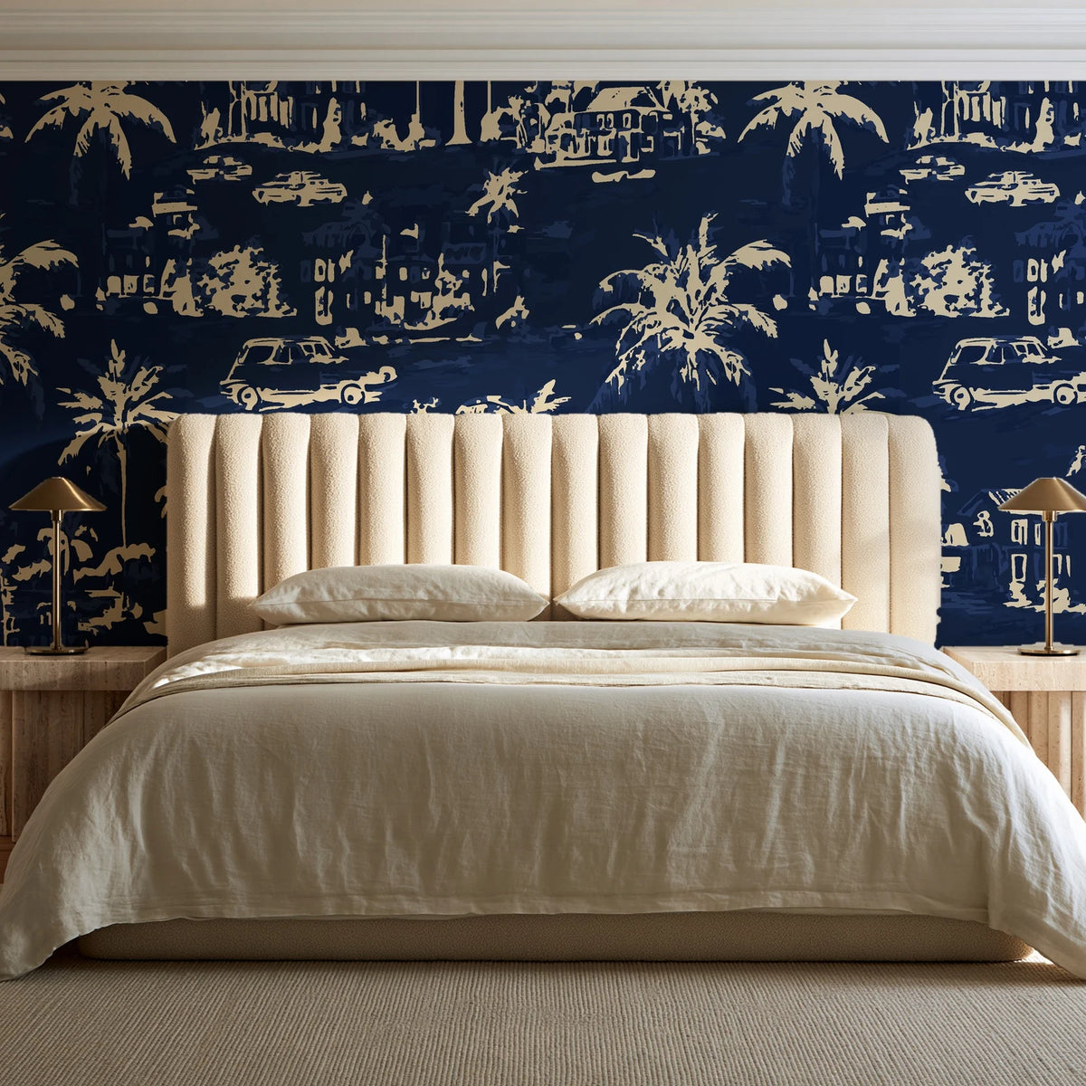 Coastal Village Midnight palm toile wallpaper behind a channel-tufted bed in a calm primary bedroom