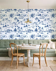 Coastal Village Navy palm toile wallpaper as a feature wall in a sunlit breakfast nook