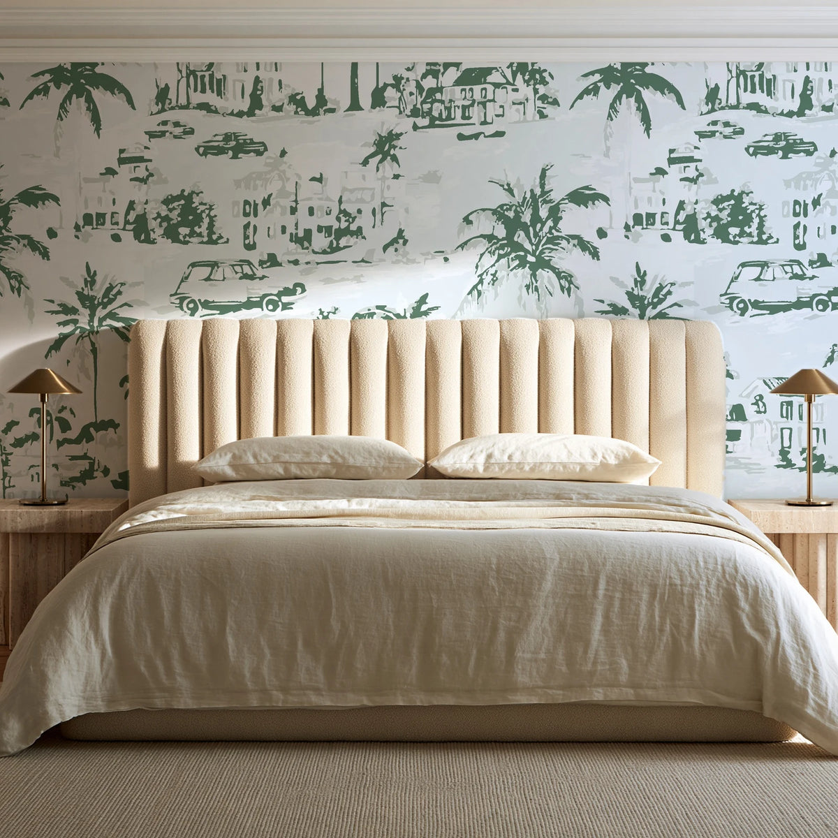 Coastal Village Sage palm toile wallpaper behind a channel-tufted bed in a calm primary bedroom