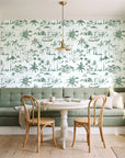 Coastal Village Sage palm toile wallpaper as a feature wall in a sunlit breakfast nook