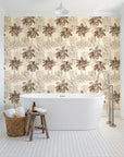 Conservatory Greens Chestnut tropical palm toile wallpaper behind a freestanding tub in a bright coastal bathroom