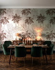 Conservatory Greens Chestnut tropical palm toile wallpaper in a dark moody dining room with a candlelit table
