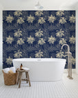 Conservatory Greens Midnight tropical palm toile wallpaper behind a freestanding tub in a bright coastal bathroom