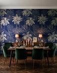 Conservatory Greens Midnight tropical palm toile wallpaper in a dark moody dining room with a candlelit table