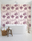Conservatory Greens Mulberry tropical palm toile wallpaper behind a freestanding tub in a bright coastal bathroom
