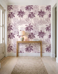 Conservatory Greens Mulberry tropical palm toile wallpaper behind a console table in a light entry hallway