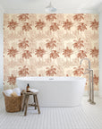 Conservatory Greens Terracotta tropical palm toile wallpaper behind a freestanding tub in a bright coastal bathroom