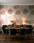 Conservatory Greens Terracotta tropical palm toile wallpaper in a dark moody dining room with a candlelit table