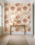 Conservatory Greens Terracotta tropical palm toile wallpaper behind a console table in a light entry hallway