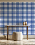 Cotton Candy Navy gingham wallpaper on the wall of a grand entry foyer