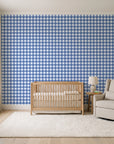 Cotton Candy Navy gingham wallpaper in a calm, light-filled nursery