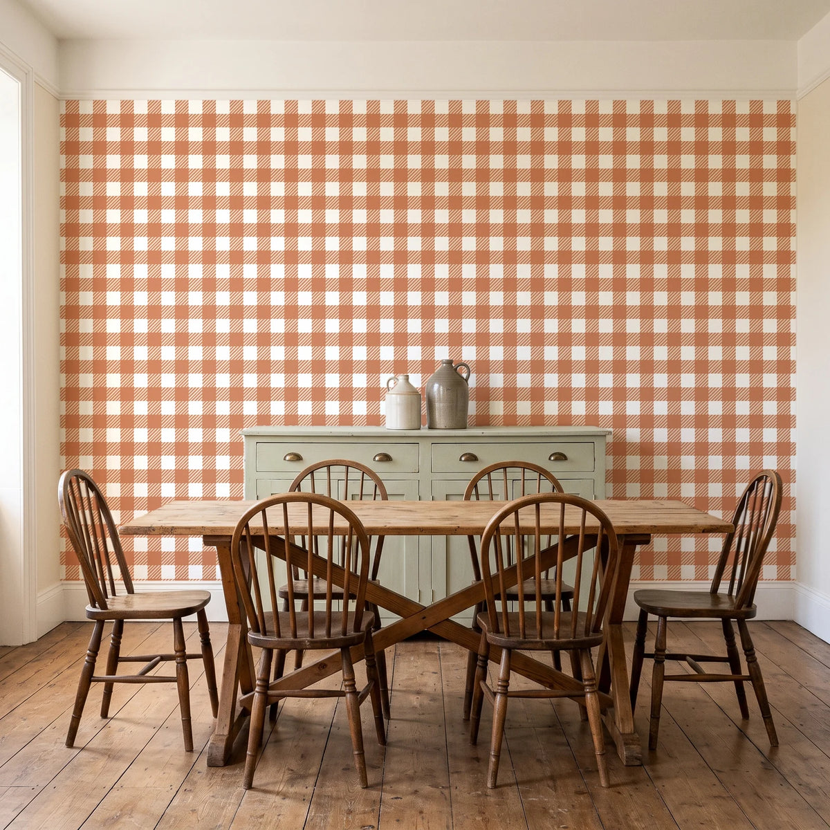 Cotton Candy Terracotta gingham wallpaper in a farmhouse dining room with a sage sideboard and rustic trestle table