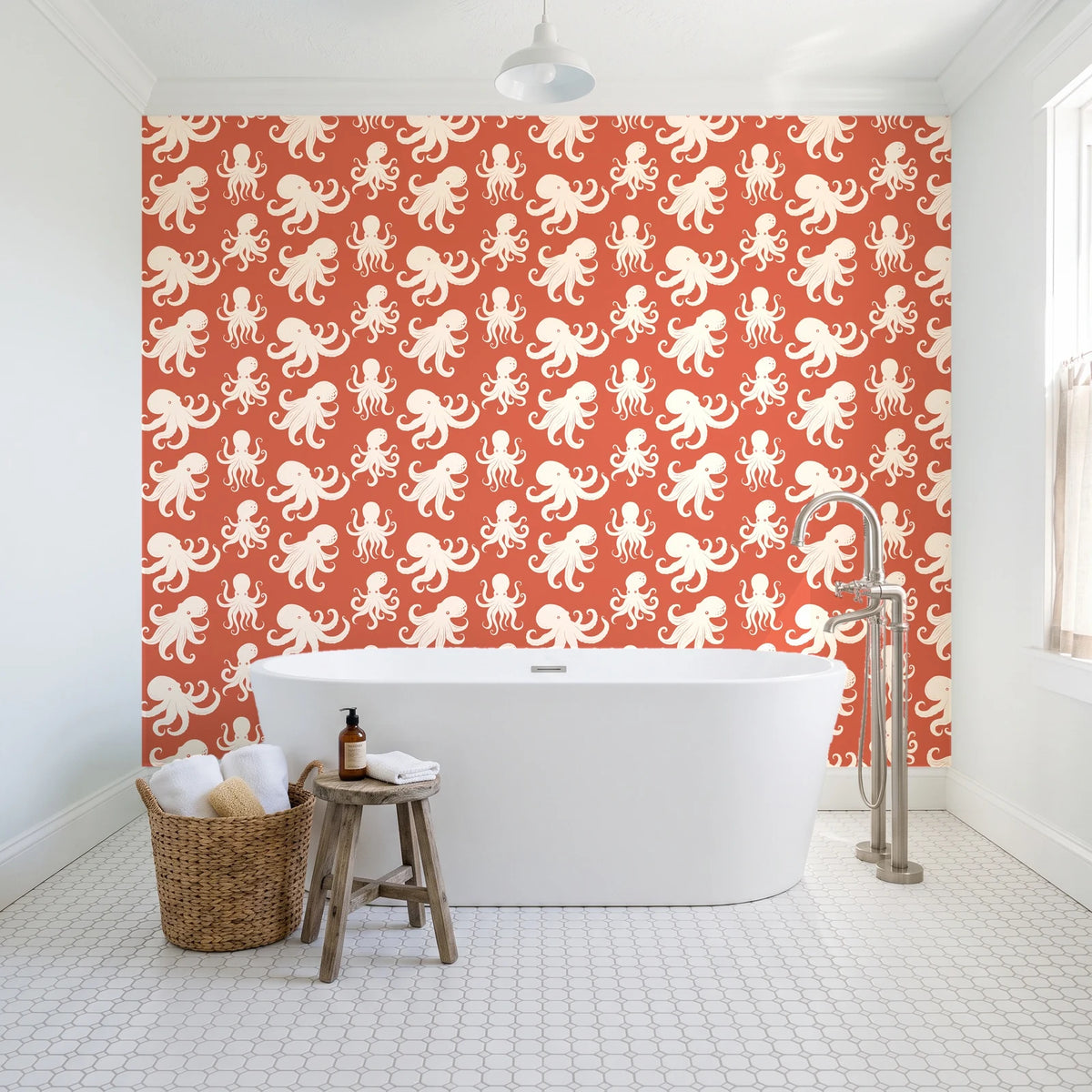 Cresting Wave Coral octopus wallpaper behind a freestanding tub in a bright coastal bathroom