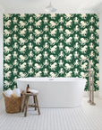 Cresting Wave Forest octopus wallpaper behind a freestanding tub in a bright coastal bathroom
