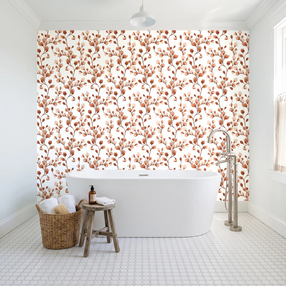 Desert Bloom Terracotta botanical vine wallpaper behind a freestanding tub in a bright coastal bathroom
