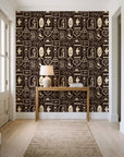 Desert Charms Espresso western icon wallpaper behind a console table in a light entry hallway