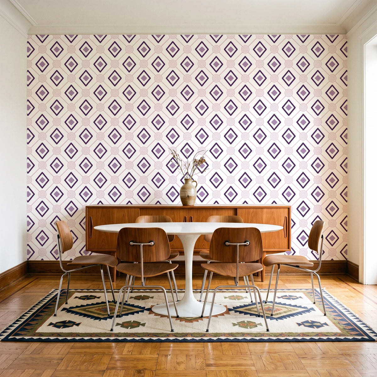 Desert Compass Aubergine geometric diamond wallpaper in a mid-century dining room with a teak sideboard and tulip table