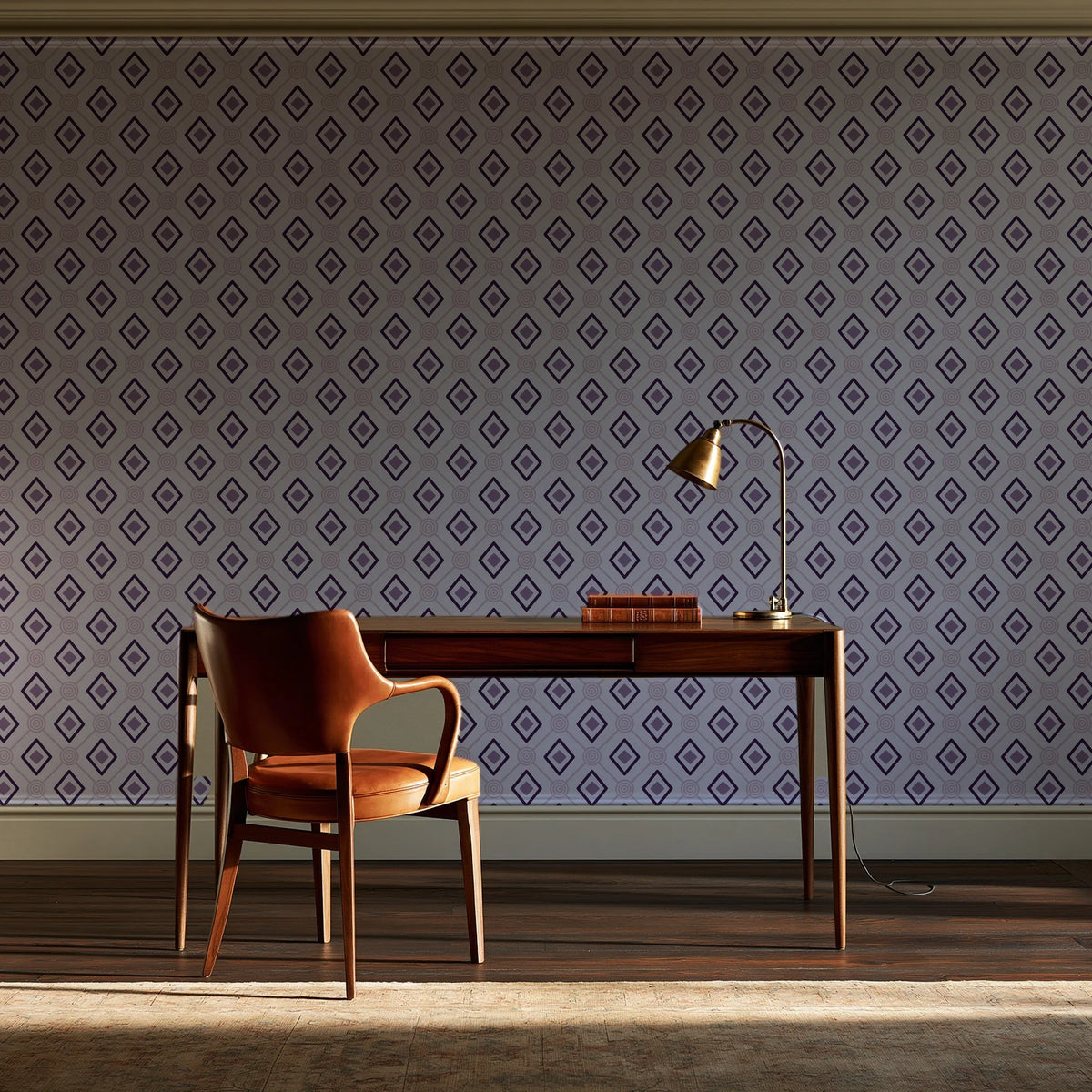 Desert Compass Aubergine geometric diamond wallpaper as a feature wall in a home study