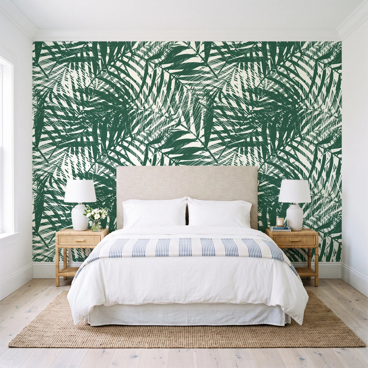 Desert Frond Emerald palm frond wallpaper behind a queen bed in a bright coastal bedroom