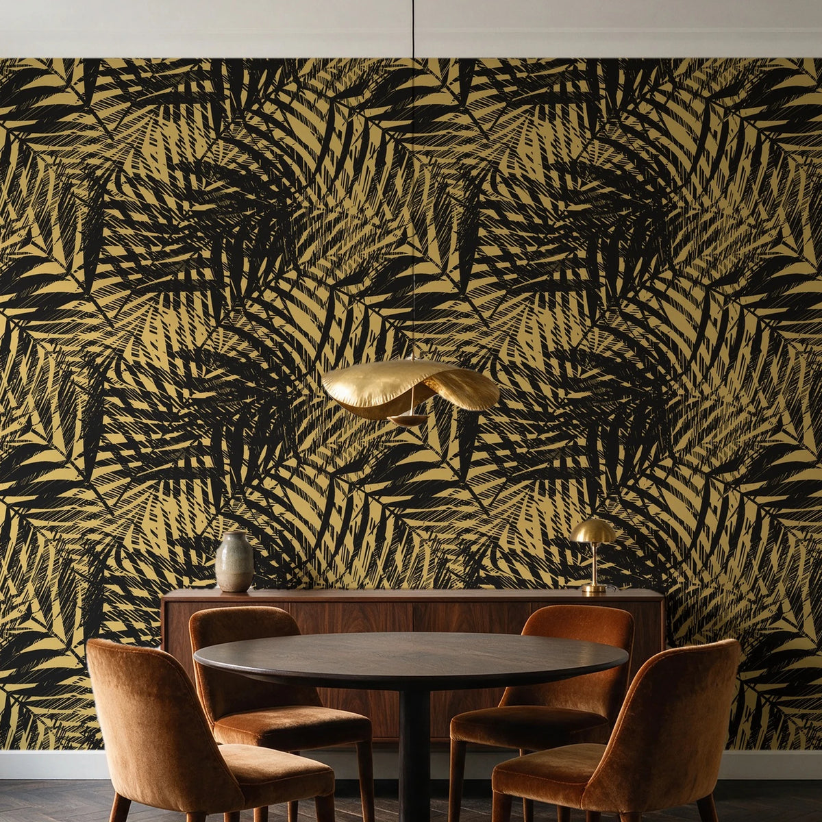 Desert Frond Gilt palm frond wallpaper behind a walnut credenza and round table in an elegant dining room