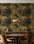 Desert Frond Gilt palm frond wallpaper behind a walnut credenza and round table in an elegant dining room