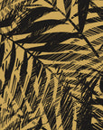 Desert Frond Gilt palm frond wallpaper in black and gold
