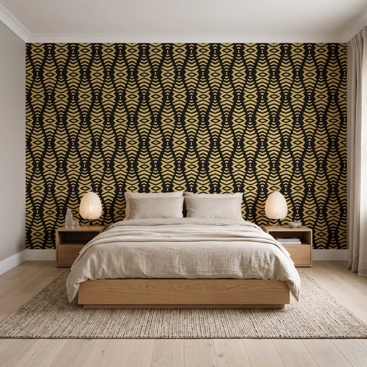 Desert Ritual Noir tribal geometric wallpaper behind a low platform bed in a serene Japandi bedroom