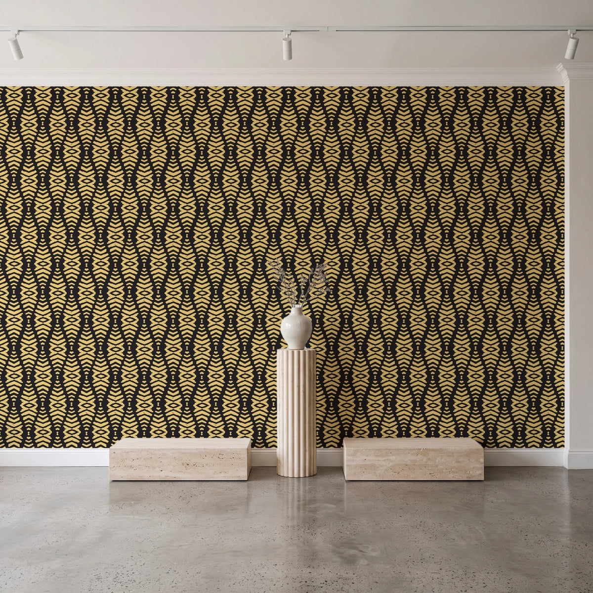 Desert Ritual Noir tribal geometric wallpaper behind a travertine pedestal and vase in a minimal boutique