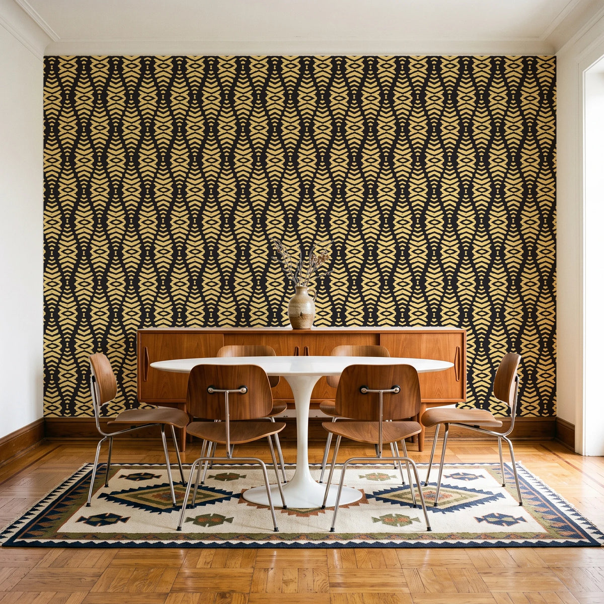 Desert Ritual Noir tribal geometric wallpaper in a mid-century dining room with a teak sideboard and tulip table