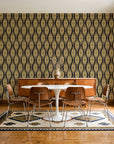 Desert Ritual Noir tribal geometric wallpaper in a mid-century dining room with a teak sideboard and tulip table